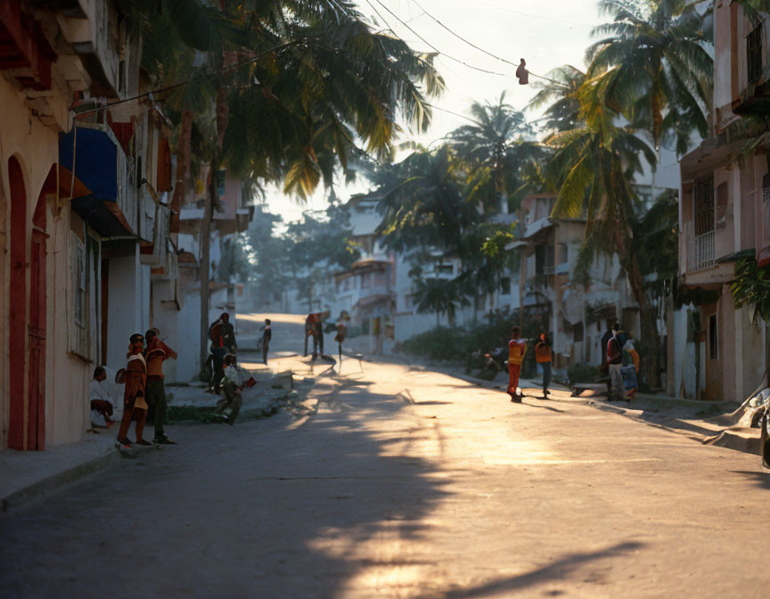 Urban street scene at sunrise or sunset with old buildings and power lines.