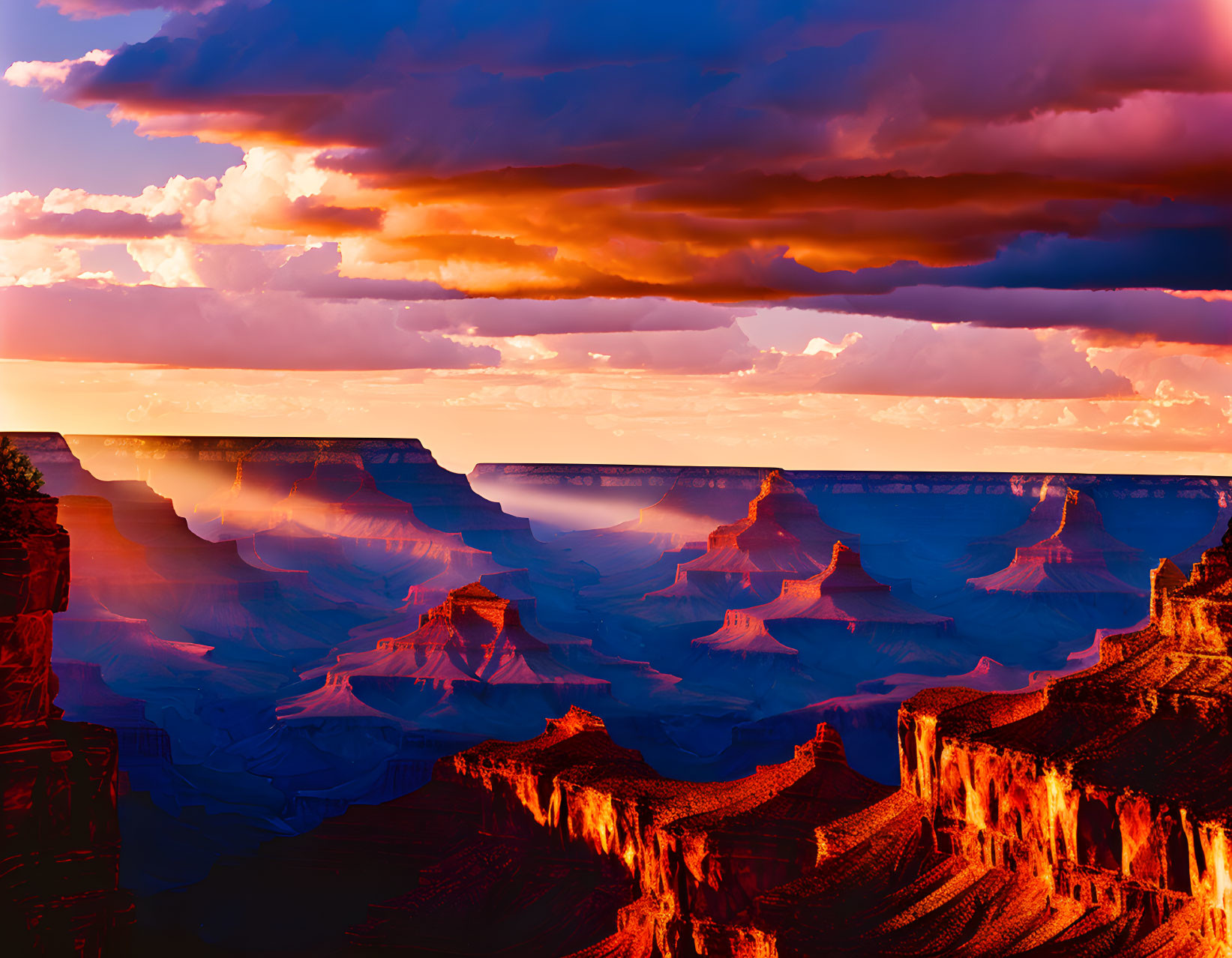 Vibrant Sunset Over Orange and Purple Canyon Rocks