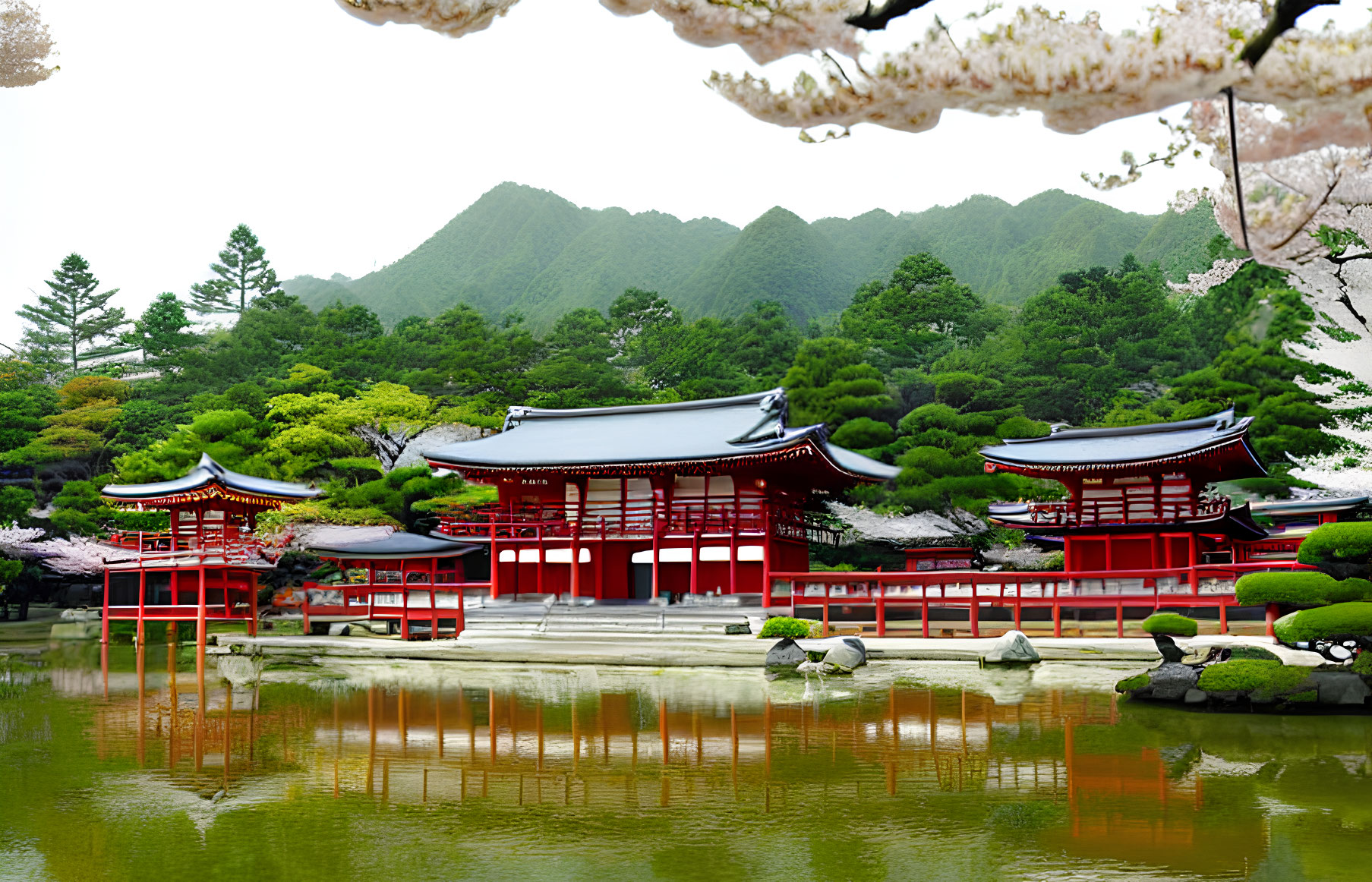 Serene pond reflects red Japanese buildings surrounded by cherry blossoms