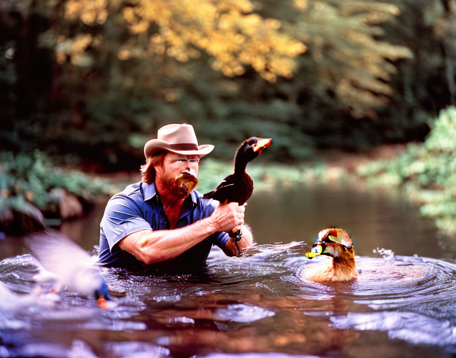 Man with mustache holding duck decoy by river with real duck