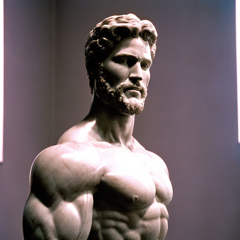 Classical sculpture of bearded male figure with defined muscles and contemplative expression