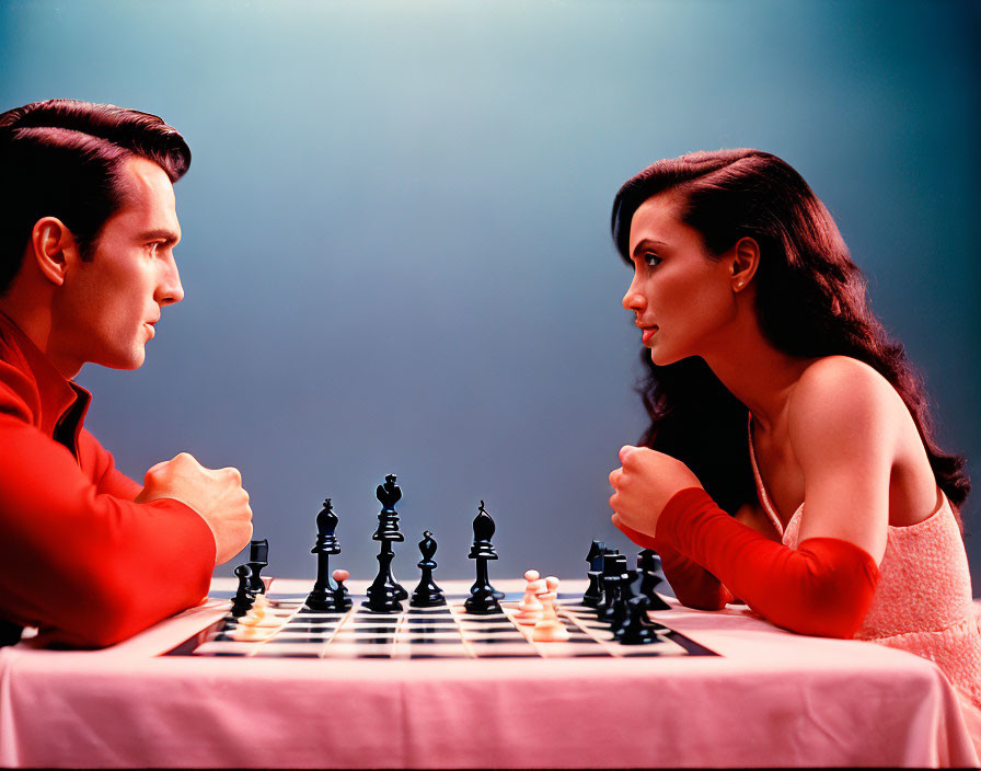 Man and woman playing chess on blue-red gradient background