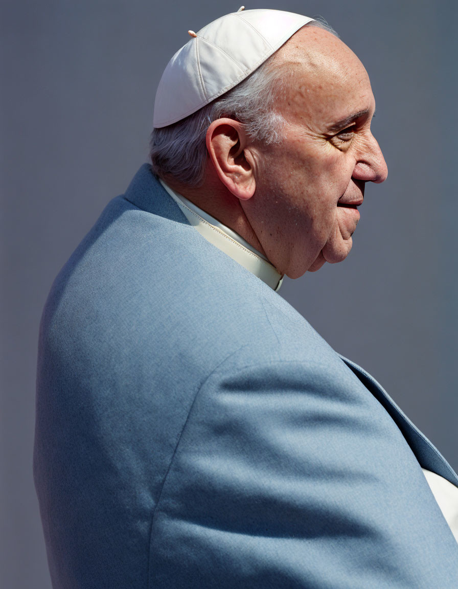 Religious man in white skullcap smiling - Side profile portrait