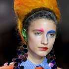 Surreal portrait of a woman with golden hair and floral adornments