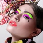 Illustrated woman with floral crown and vibrant makeup in fantasy setting