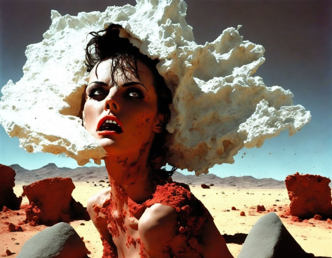 Person covered in red substance with white cloud-like structure on head in desert.