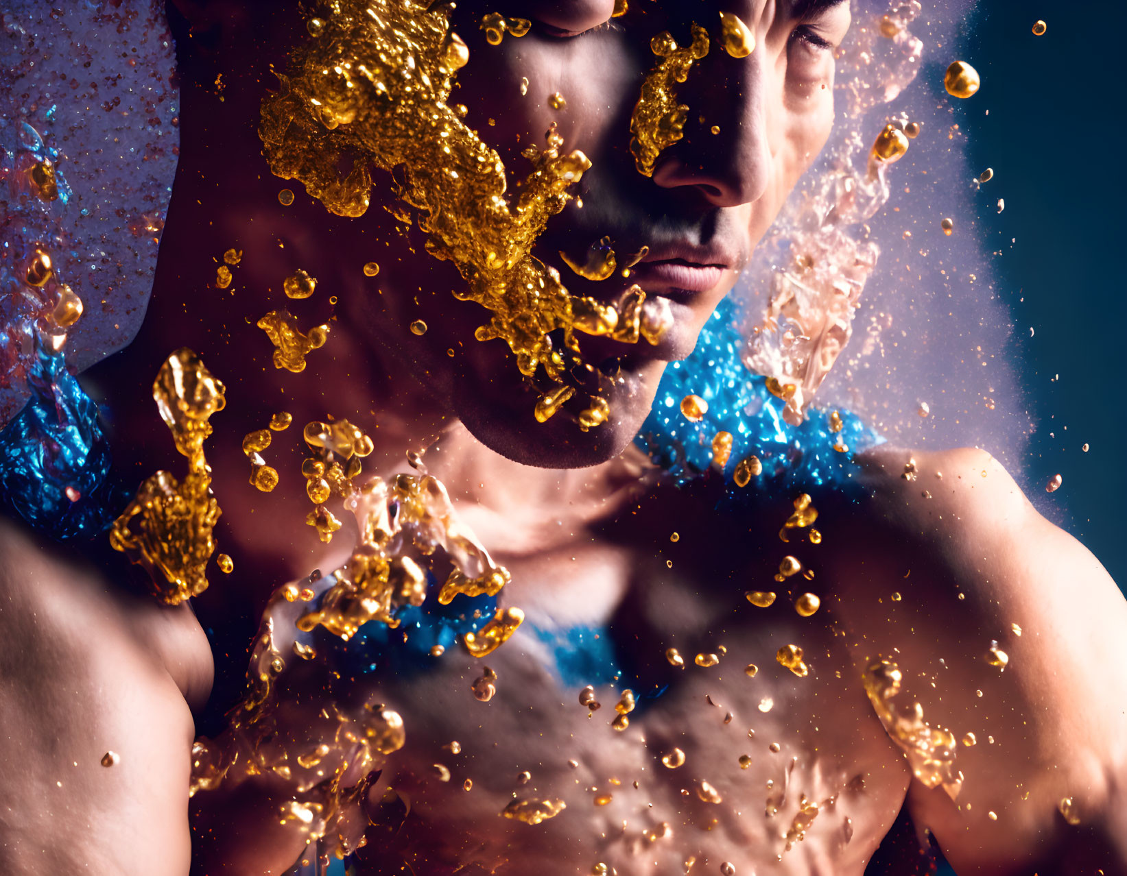 Man's face and body disintegrating into golden glitter and water droplets on dark backdrop