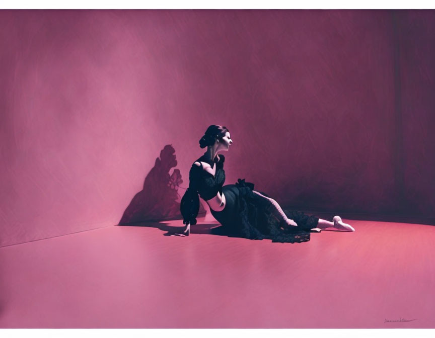 Person in dramatic black outfit against pink background with shadow cast