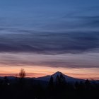 Scenic snow-covered mountain village at dusk