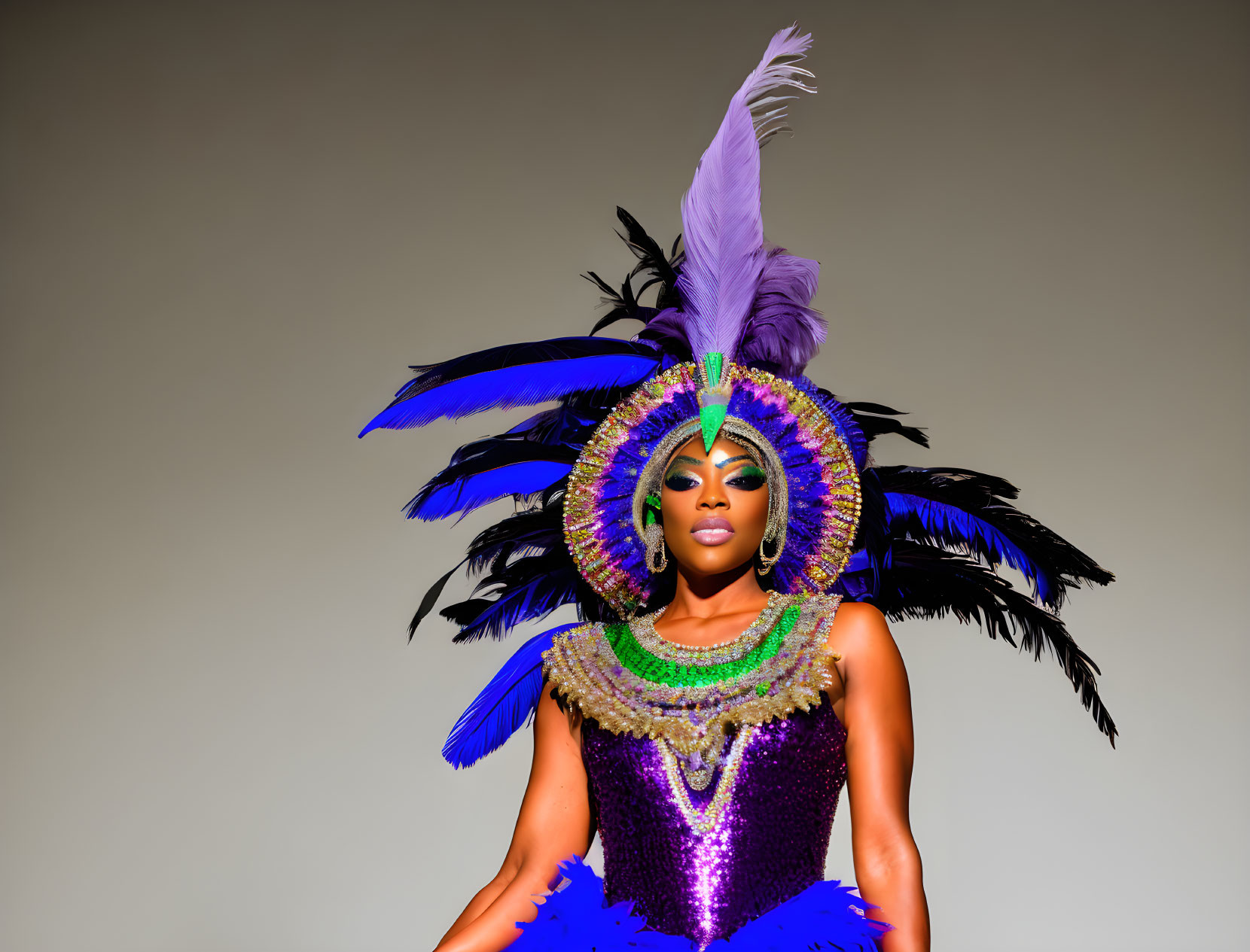 Colorful Carnival Costume with Feathered Headdress and Bejeweled Outfit on Neutral Background