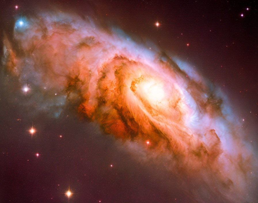 Swirling galaxy with bright core and colorful interstellar clouds