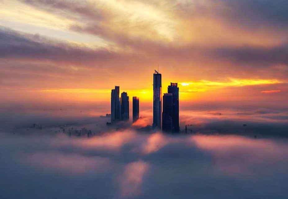 Tall skyscrapers under colorful sunrise sky