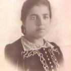 Vintage Portrait of Lady with Curled Hair, Prominent Lipstick, Necklace, Floral Dress