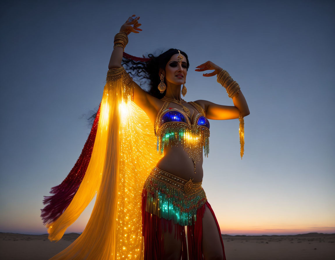 Traditional desert dance at twilight with vibrant illuminated costume