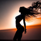 Profile of Woman with Flowing Hair at Sunset