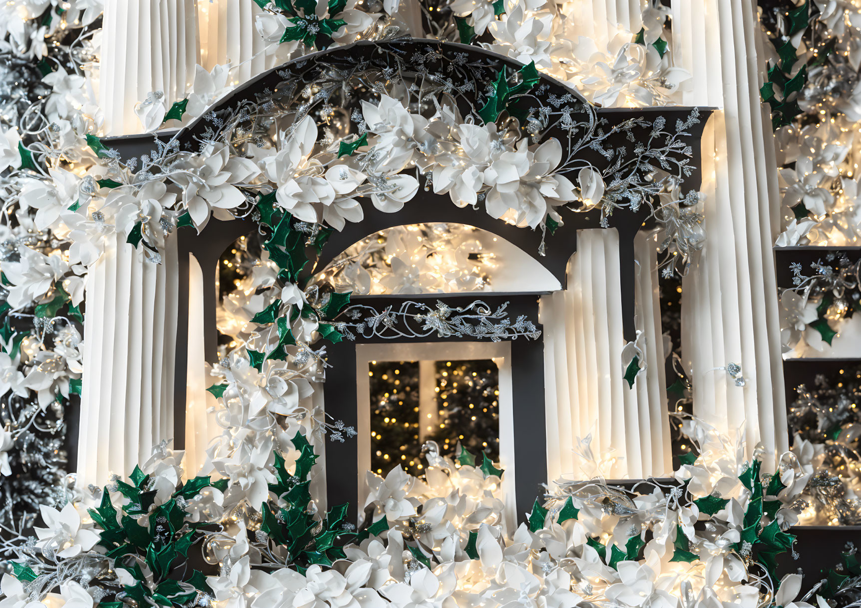 Black and White Arch with Floral Decor and Twinkling Lights