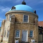 Ornate blue-domed building with intricate fairy-tale architecture