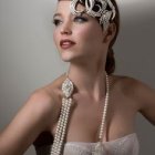 Elegant woman with pearl necklaces and ornate headdress in digital portrait