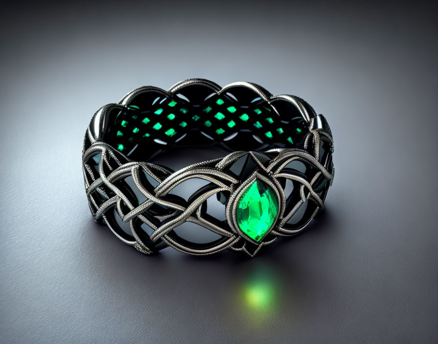 Silver Celtic Knot Bracelet with Green Gemstone on Dark Background