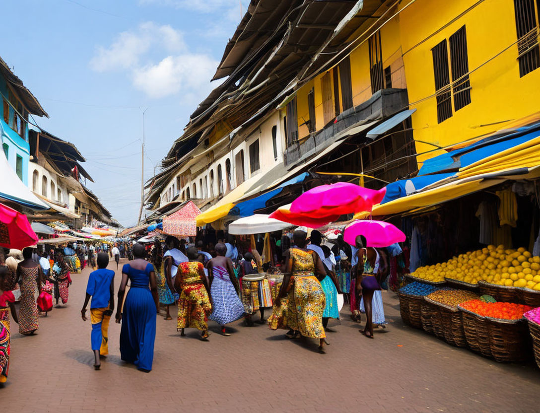 Busy market street scene with colorful umbrellas, fruit stalls, and vibrant buildings