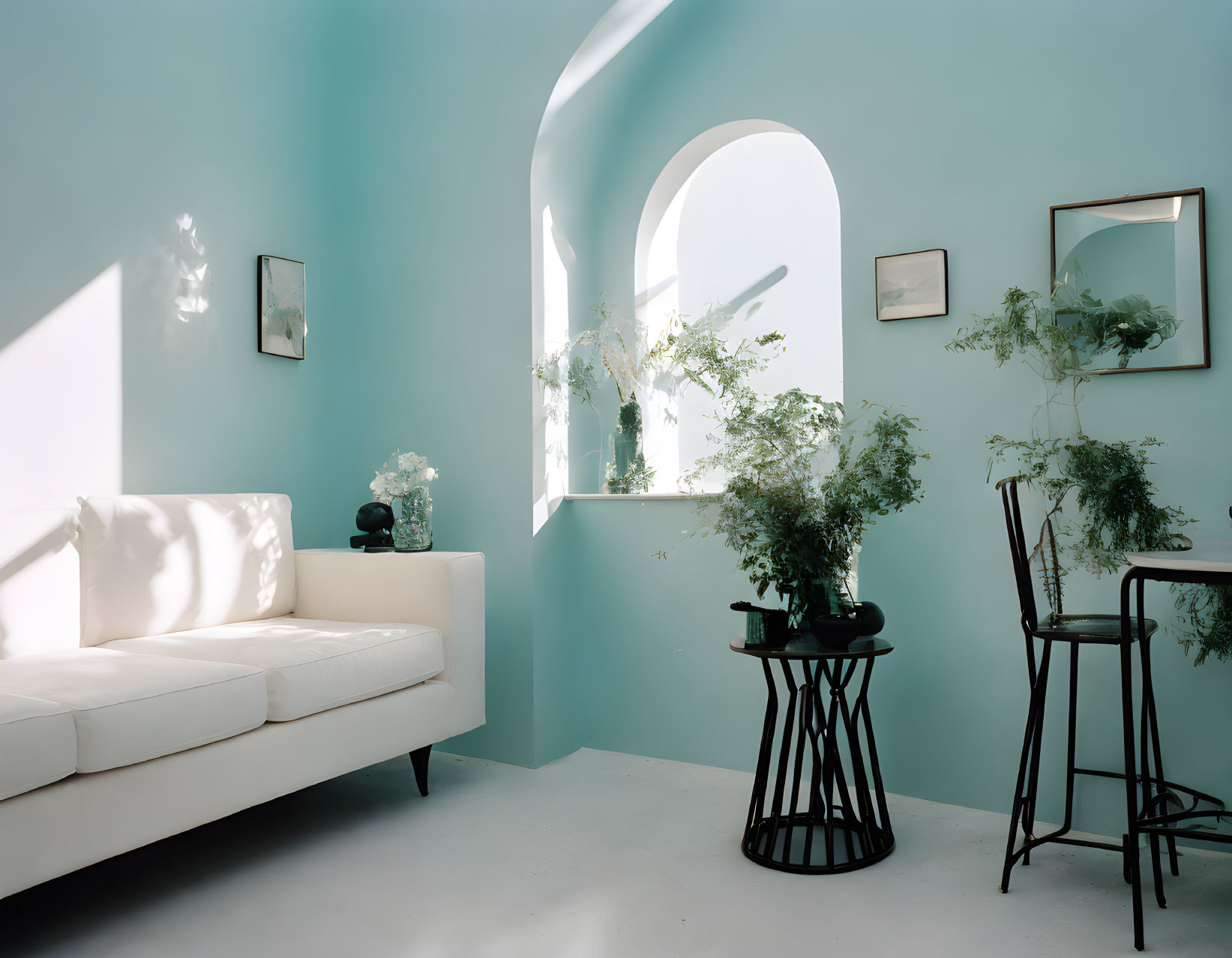 Minimalist Room with Sky-Blue Walls, White Sofa, Black Tables & Green Plants