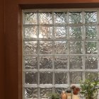 Intricate Floral Stained-Glass Window Against Pink Wall