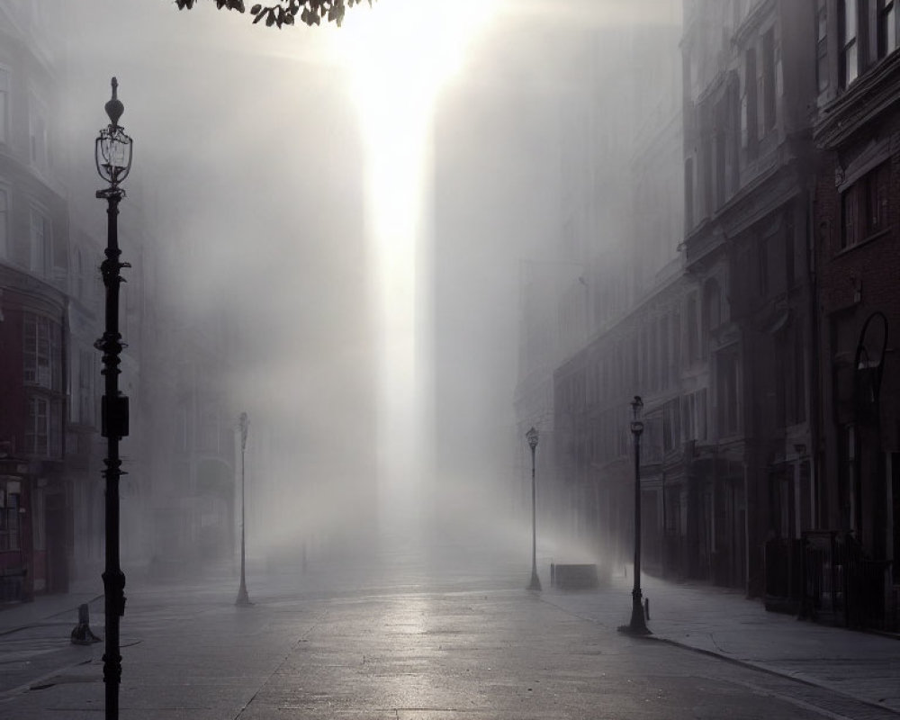 Urban street scene with sunlight filtering through dense fog