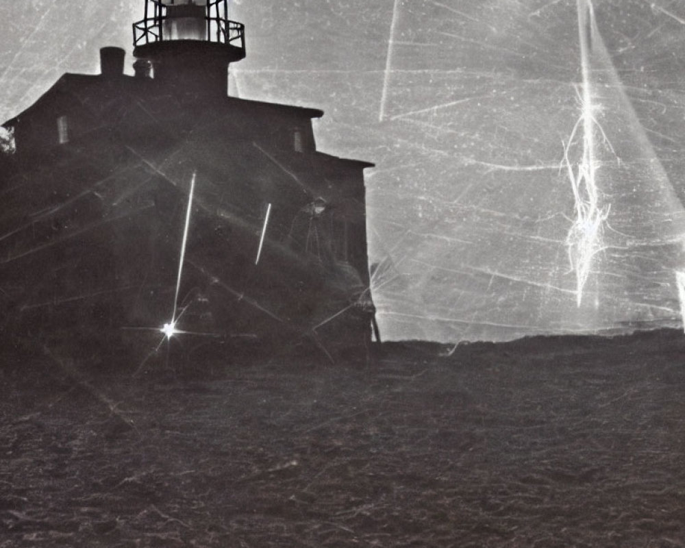 Monochromatic lighthouse photo with scratched overlay