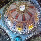 Intricate gem-studded ceiling with central medallion