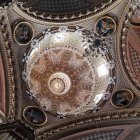 Elaborate Moldings and Frescoes in Ornate Ceiling