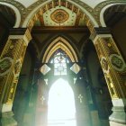 Intricate Golden Patterns in Arched Interior