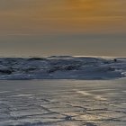 Sunlit Icebergs in Tranquil Icy Sea