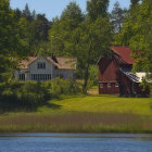 Quaint Thatched Roof Houses by Serene Pond