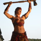 Fantasy warrior woman in intricate armor wields double-bladed axe