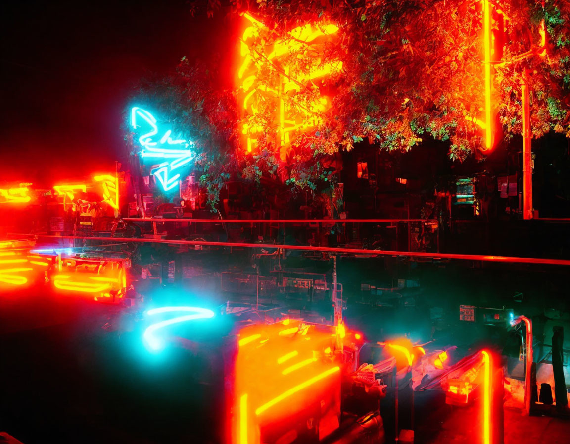 Vibrant red and blue neon lights illuminate outdoor scene at night