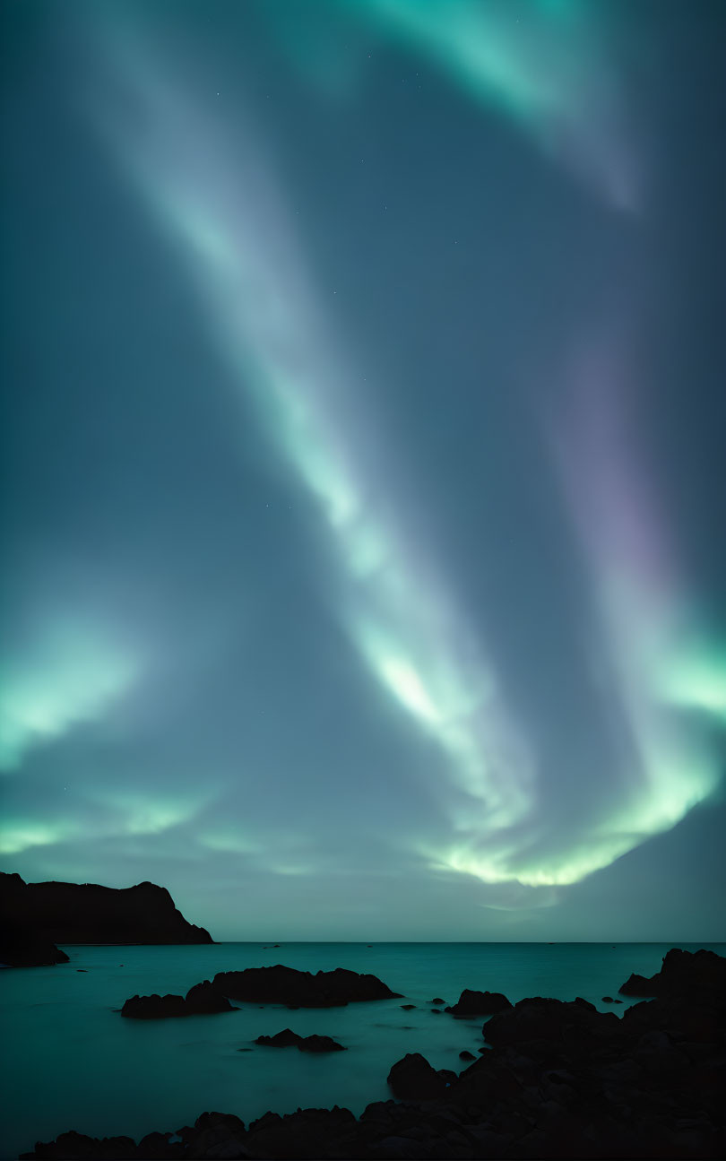 Ethereal green aurora borealis over starlit night ocean