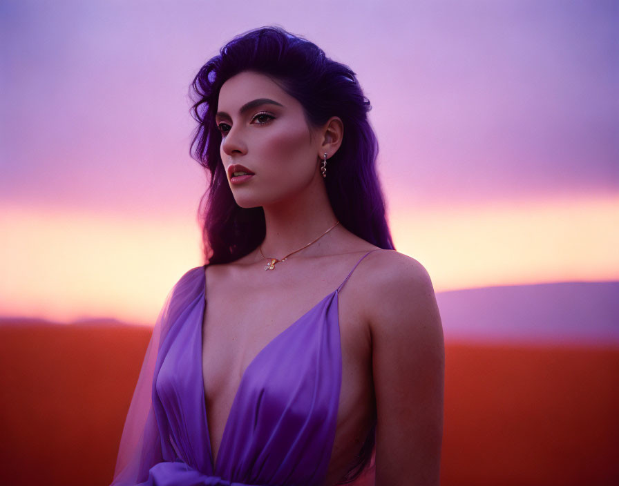 Woman in Purple Dress Poses Against Twilight Sky