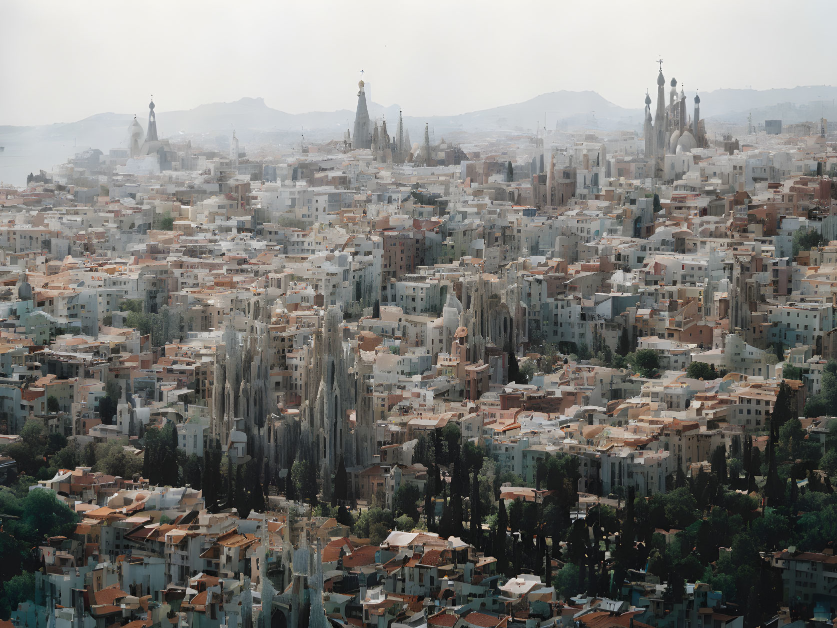 Crowded cityscape with towering spires and hazy sky