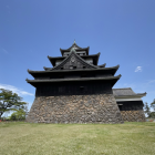 Asian-style Pavilions with Upturned Eaves and Warrior Statues in Greenery