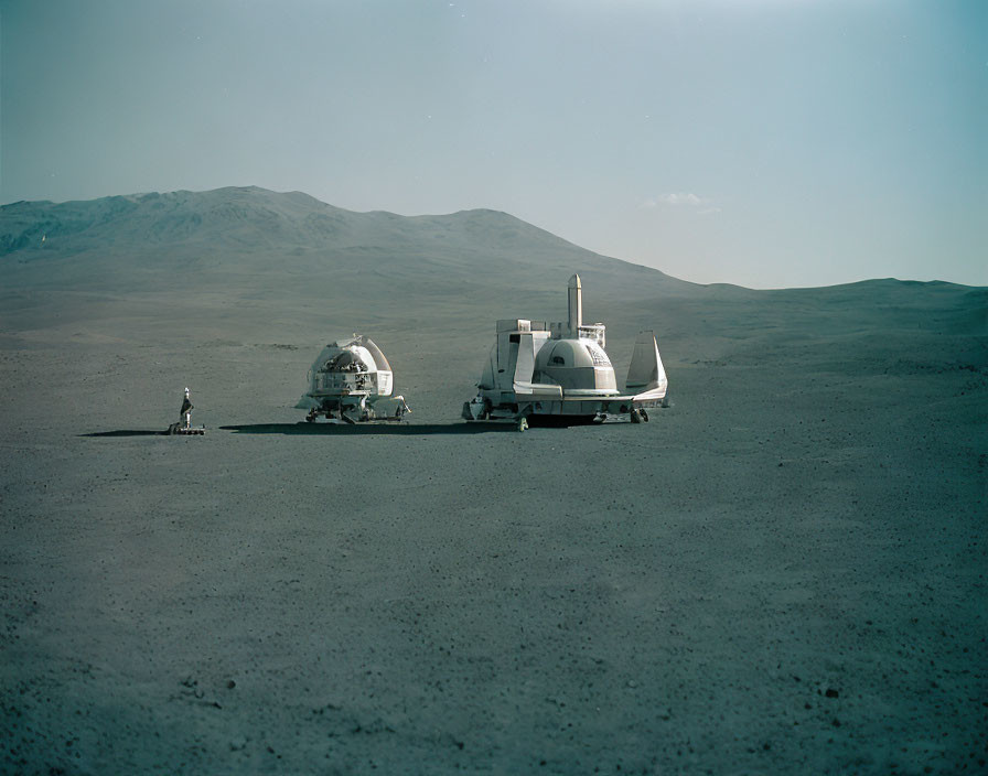 Futuristic modules with rocket in barren desert landscape