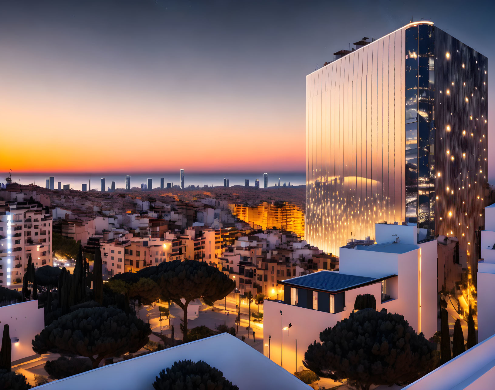 Twilight cityscape with illuminated high-rise building and orange sky.