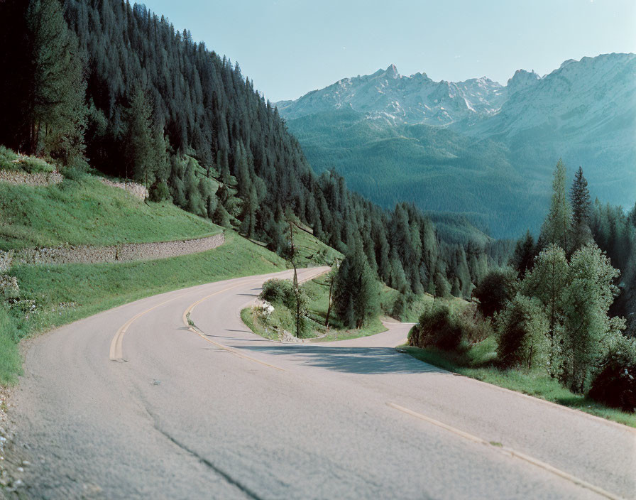 Scenic winding road in lush mountain landscape