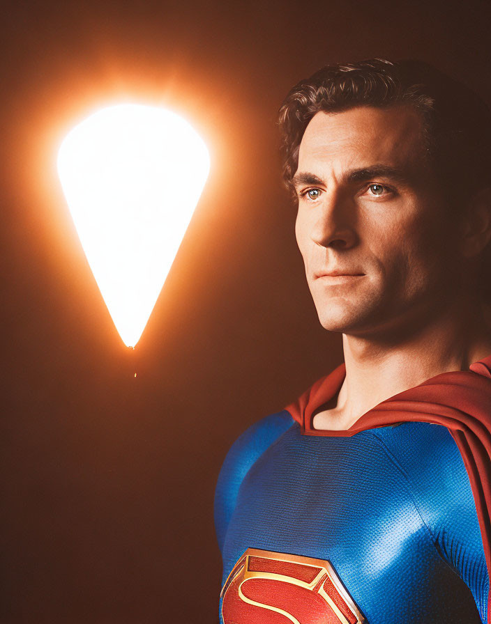 Person in Superman costume gazes with comet-like light.