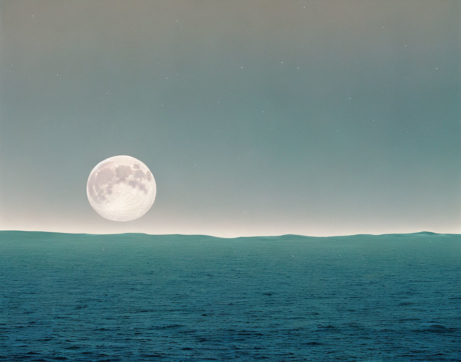 Full Moon over Calm Ocean Horizon at Twilight