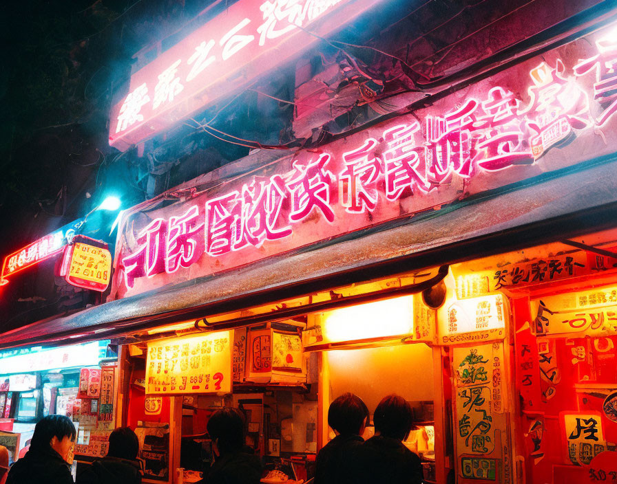 Vibrant Nighttime Street Food Stall with Neon Signs and Patrons