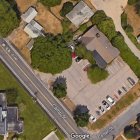 Suburban Neighborhood with Winding Roads and Colorful Flowerbeds