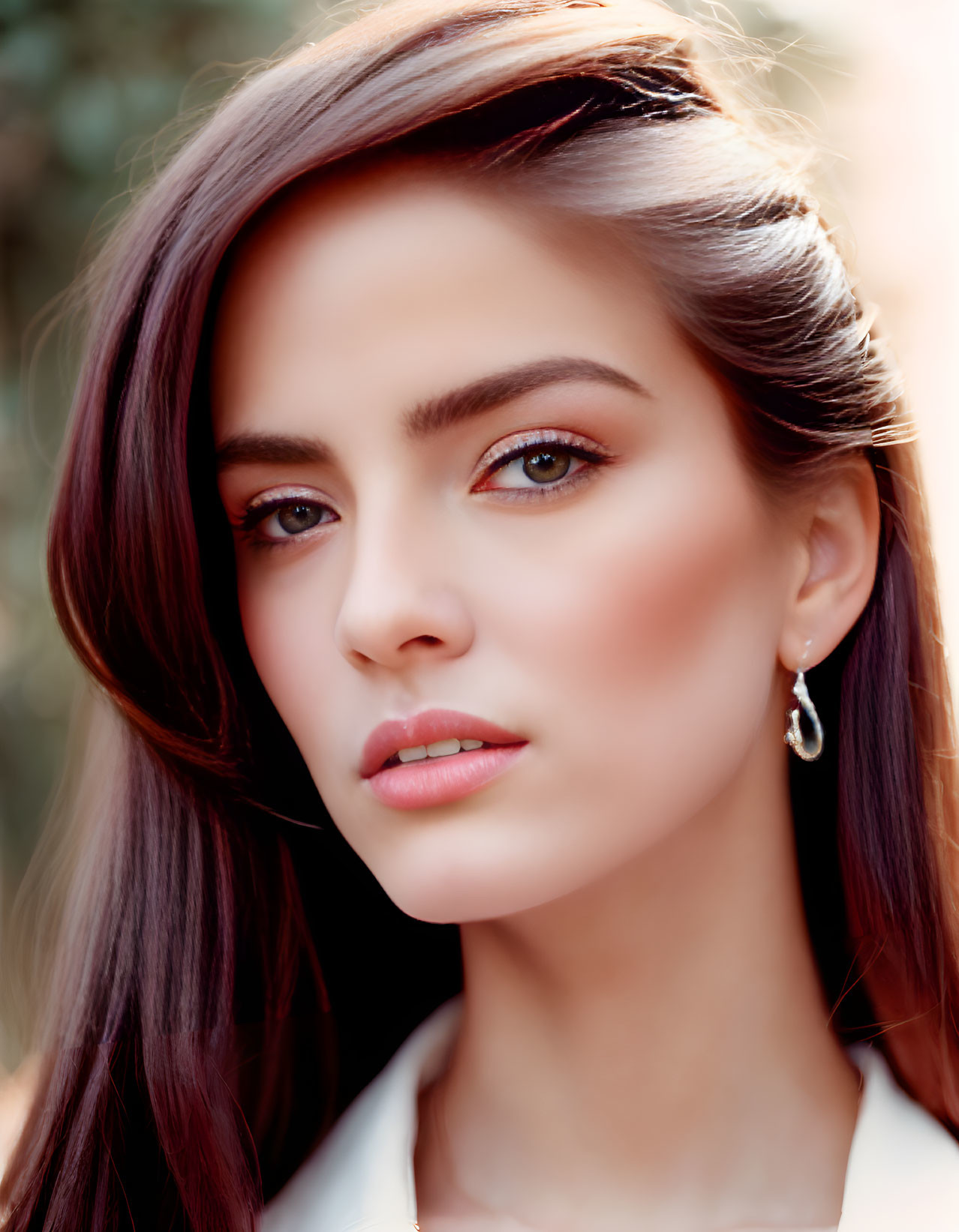 Portrait of a Woman with Long Brunette Hair and Striking Brown Eyes