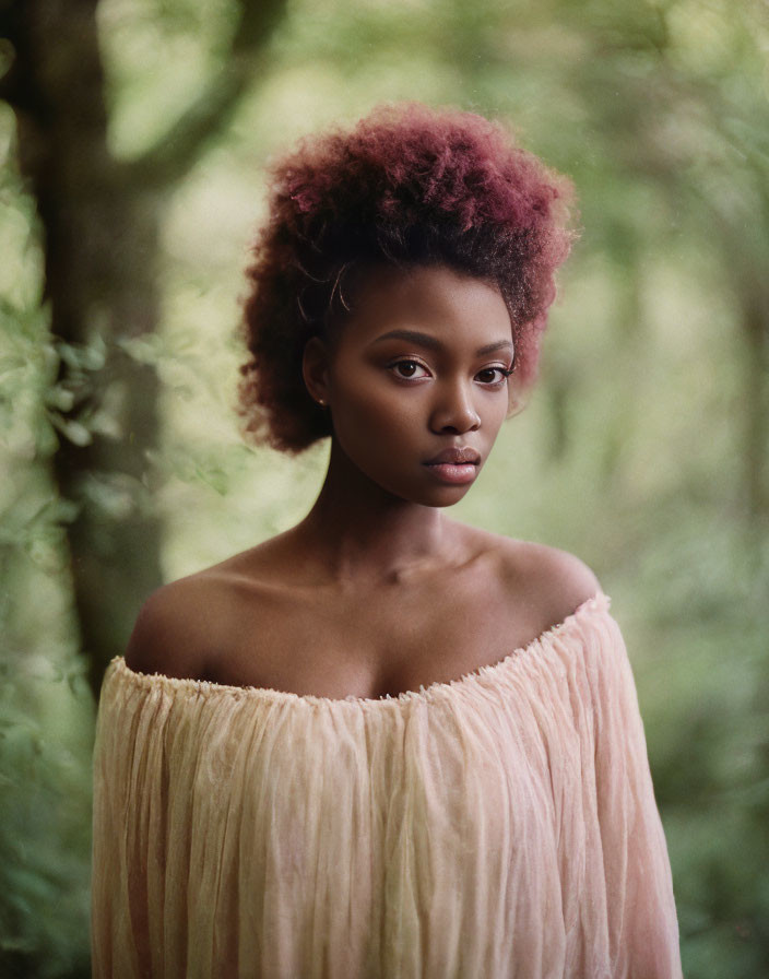 Pink Afro Woman in Off-Shoulder Top on Greenery Background