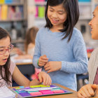 Diverse students studying in bright classroom