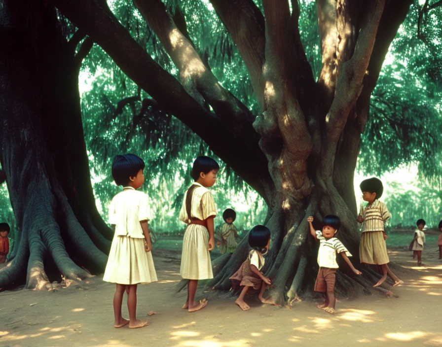 Kids playing around large tree in green park